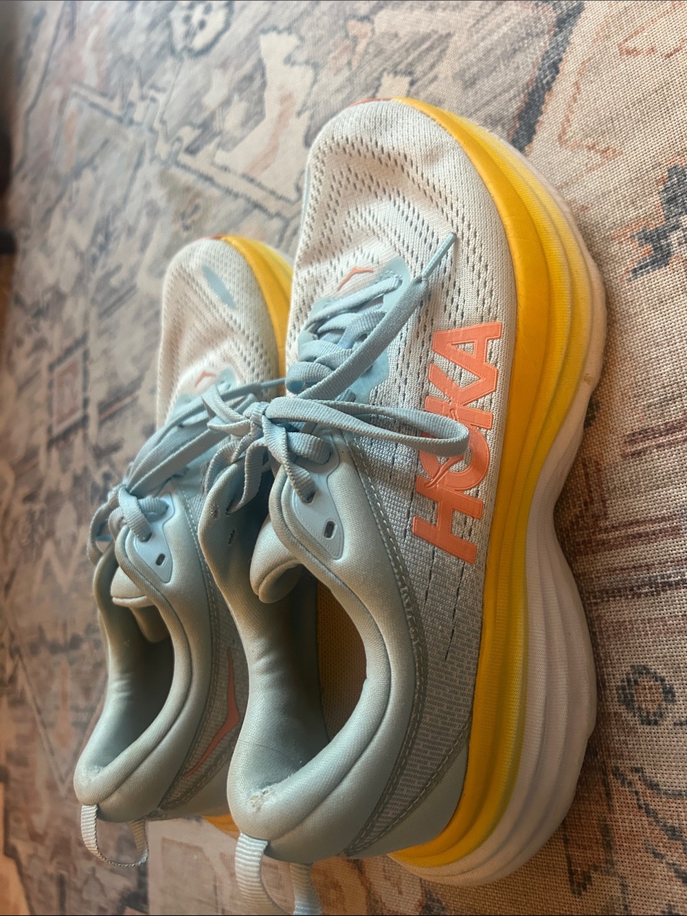 Hoka Light Blue Running Shoes with Yellow Midsole and Coral Logo